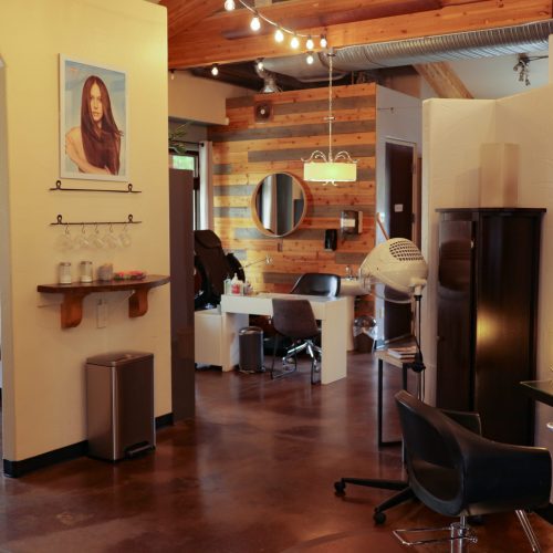 The MaZa Salon interior features a gorgeous, relaxing atmosphere with beautiful spaces and fun lighting.